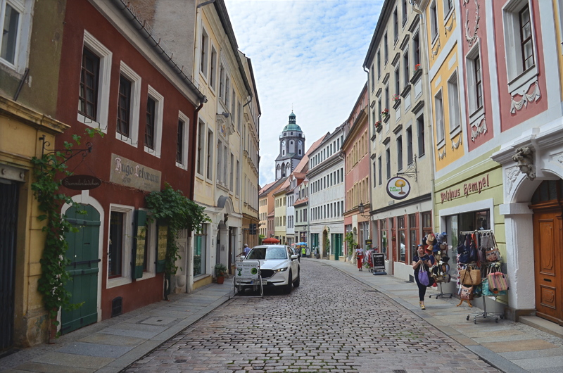 8 - Burgstraße in the historic old town of Meißen, Saxony, featuring colorful Renaissance and Gothic townhouses with the distinctive tower of the Frauenkirche